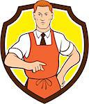 Illustration of a cook chef with hand on hips pointing facing front set inside shield crest on isolated background done in cartoon style.