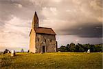 Old Roman Catholic Church of St. Michael the Archangel with Rainbow on the Hill in Drazovce, Slovakia