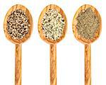 hemp seed, hearts and protein powder on isolated wooden spoons