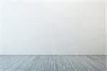 empty room with white wall and wooden floor