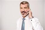 Mature businessman talking on mobile phone