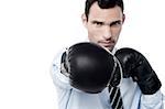 Businessman ready to fight with boxing gloves