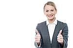 Business woman making thumbs up gesture