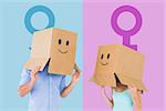 Couple wearing emoticon face boxes on their heads against female gender symbol