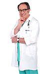 Isolated senior male doctor posing against white background