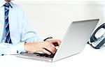 Closeup shot of man working on a laptop isolated over white background