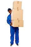 Full length portrait of a delivery boy carrying heavy boxes isolated on white