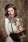 beautiful woman with vintage style taking in the hands easter eggs in cheerful basket and lovely tender rabbit