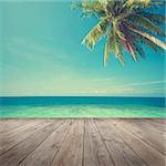 Retro vintage style summer sea view with coconut tree with wooden floor.