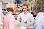 Pharmacist and sick customer speaking in the pharmacy