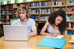 Students studying together in the library at the university