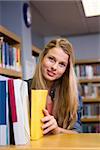 Pretty student in the library at the university