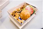 Hamburger and Potato Chips in Take-out Box, Studio Shot