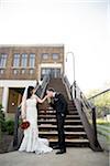 Portrait of Bride and Groom at Bottom of Staircase Outdoors, Hamilton, Ontario, Canada