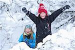 Portrait of two girls playing in the snow, winter, Bavaria, Germany