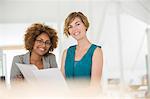 Portrait of two smiling office workers