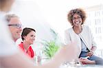 Office workers talking at desk