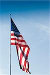 Vertical Photo of American Flag with Blue Sky