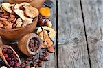 Mix of dried fruits and almonds - symbols of judaic holiday Tu Bishvat. Copyspace background.