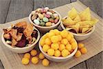 Savory snack party food selection in wooden bowls.