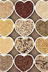Grain selection in heart shaped dishes over hessian background.