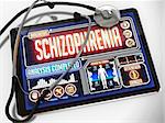 Schizophrenia - Diagnosis on the Display of Medical Tablet and a Black Stethoscope on White Background.