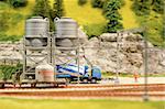 miniature model cement truck loading from track-side silos