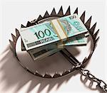 Stack of Real (Brazilian money) into a trap. Clipping path included.