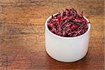 pickled beets, dulse and kale salad in a tasting bowl against rustic wood