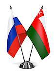 Russia and Oman - Miniature Flags Isolated on White Background.