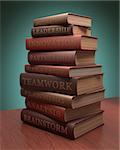 Several books stacked with lessons for achieving success. Clipping path included.