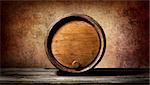 Barrel on a wooden table and brown background