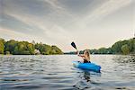 Young woman kayaking on river, Cary, North Carolina, USA