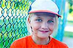 Portrait of young girl wearing baseball kit