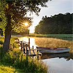 Rowboat moored at lake