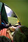 Boy sleeping in tent