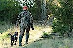 Man hunting with dog