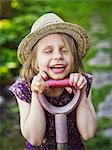 Smiling girl wearing straw hat