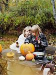 Girls preparing pumpkin