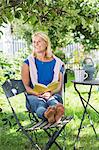 Woman reading book in garden