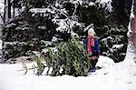 Girl in forest near pine tree