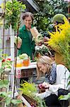 Young women looking at home-grown vegetables