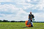 Sky-diver on airport after safe landing