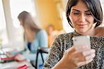 A woman checking her smart phone.