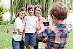 Boy photographing family