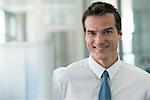 Businessman smiling cheerfully, portrait