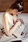 Mother breastfeeding newborn baby