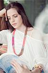 Young woman reading book