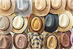 Straw hats for sale in a local street market in Bangkok, Thailand