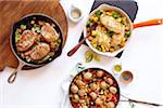 Three healthy skillet dinners with pork, meatballs and chicken, studio shot on white background